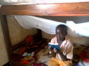 Mubogi reading his Bible
