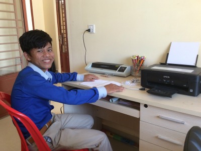 Student in Cambodia helping at an International School