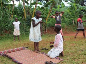 Children in Uganda acting out a play