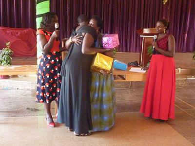 Women at the Women of Worth Workshop exchanging gifts.