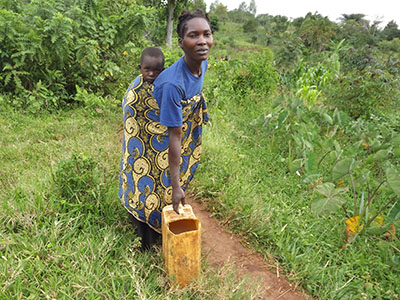 This woman has to travel miles with her baby on her back just to get filthy water.