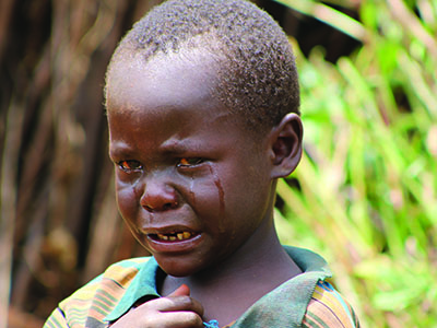 Young boy with tears streaming down his face