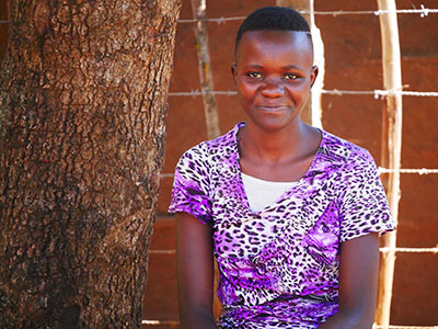 A young girl from Kenya with a slight smile