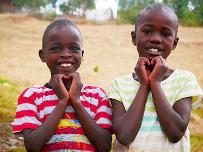 Children making hearts with their hands