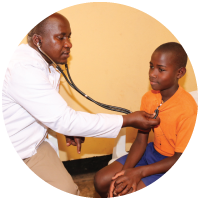 A doctor giving a medical check-up in Uganda