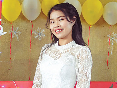 A young woman from Cambodia smiling