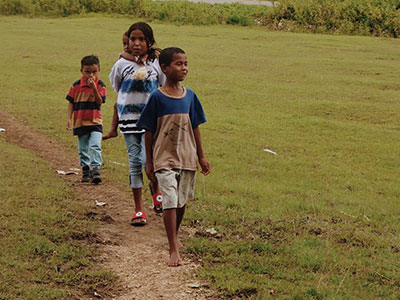 Children in Indonesia walking on a path
