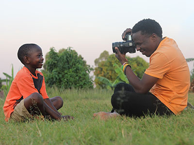 A young man taking a photo