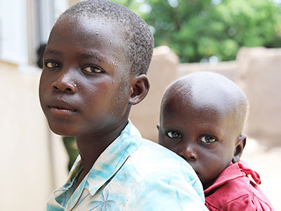 Two young children looking solemn