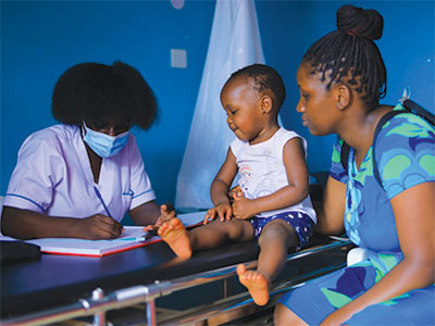 A child being seen during the medical event in Uganda