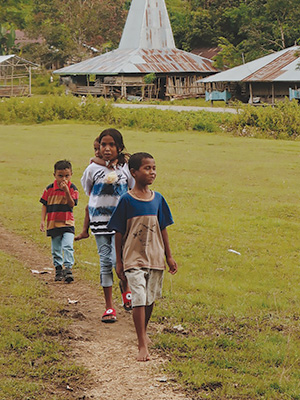 Children in Indonesia walking on a trail