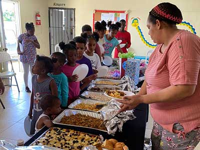 Children lined up to get their delicious Christmas meal