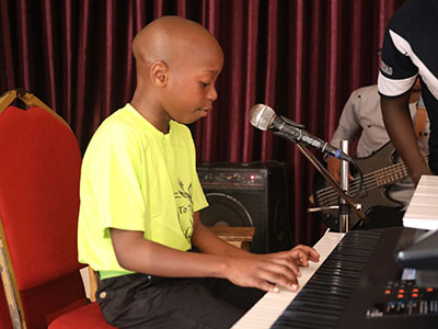 Boy playing the piano
