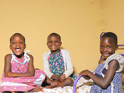 Three girls smiling at the camera