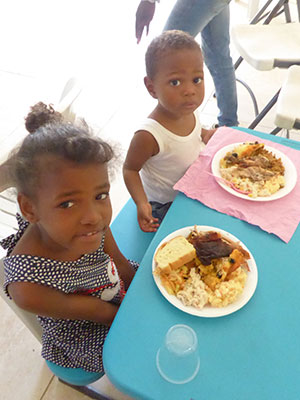 Jefferson eating dinner with another child