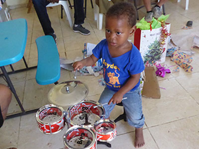 Jefferson playing a small drum set