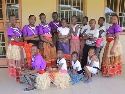 A group of children pose together with their dance troupe.