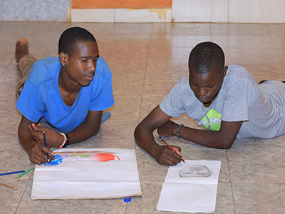 Two young men drawing