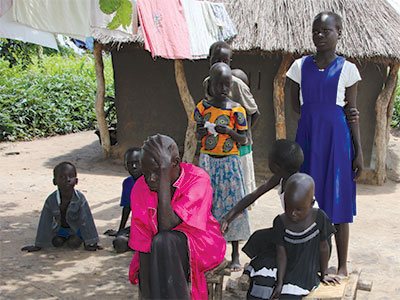 Joyce sits with her children