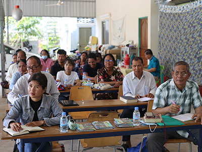 The pastors listen intently during their conference.