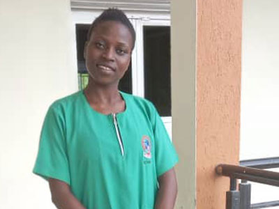 A young woman in her nurse scrubs