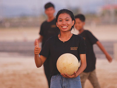 Cambodia: Kids enjoyed playing volleyball during their youth trip.