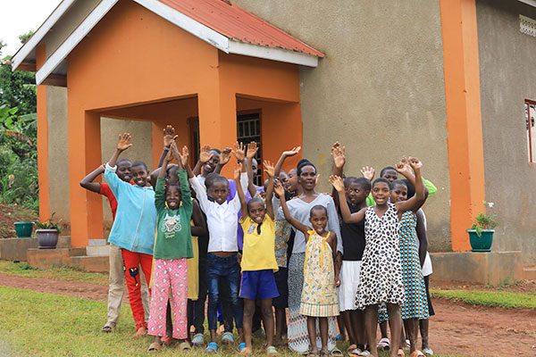 Kinship family in Uganda cheering