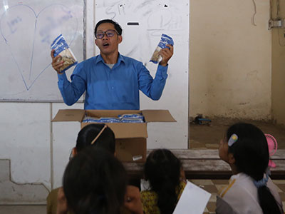 Pastor Jack speaking to a group during an outreach event.