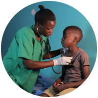 A nurse listening to a child's heart beat