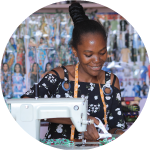 A young tailor at her sewing machine