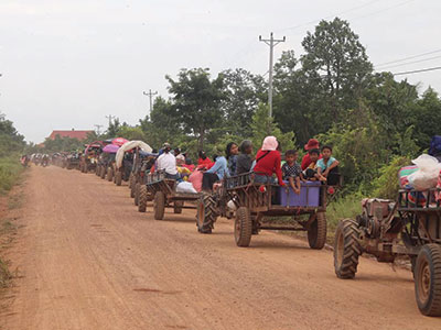 Numerous vehicles on a road in Cambodia