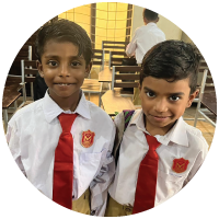 Two young boys from Pakistan in their school uniforms