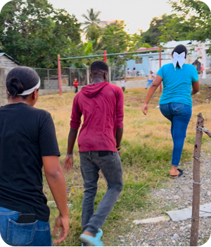 Kinship Kids walking towards a home Kinship Kids walking towards a home
