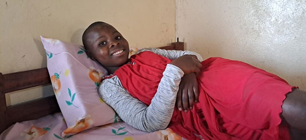 A child enjoying her new bed