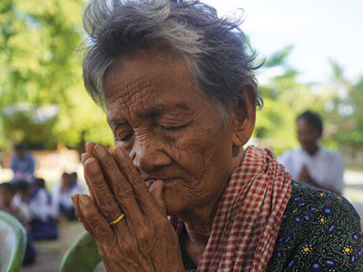 A woman praying in Cambodia