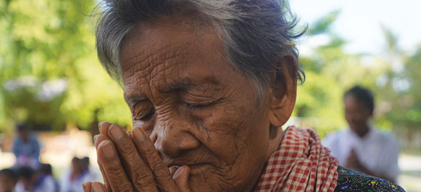 A woman praying in Cambodia