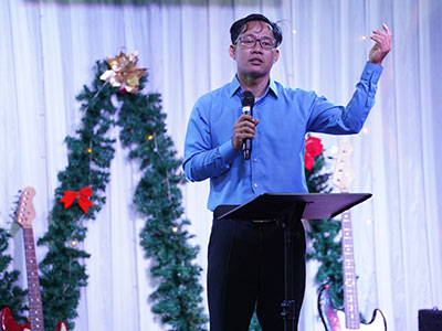 Pastor Jack preaching during Kinship Cambodia's Christmas gathering.