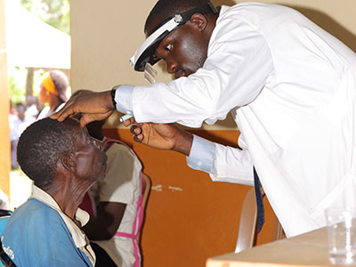 A doctor runs tests during a medical outreach event