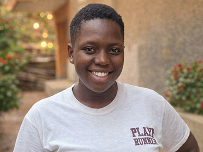 A smiling young woman in Uganda