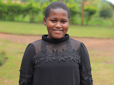 A smiling young woman in Uganda