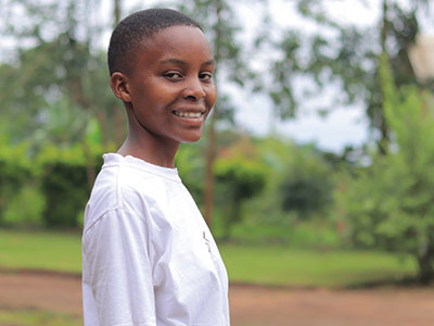 A smiling young woman in Uganda