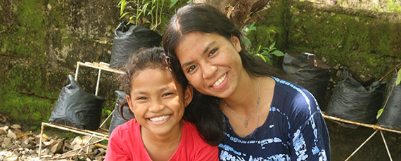 Two smiling girls in Indonesia